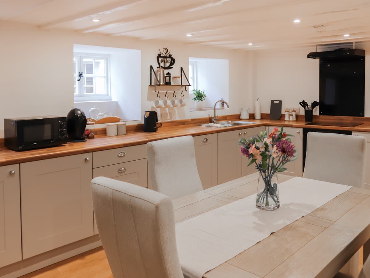 Spacious cream kitchen and dining table
