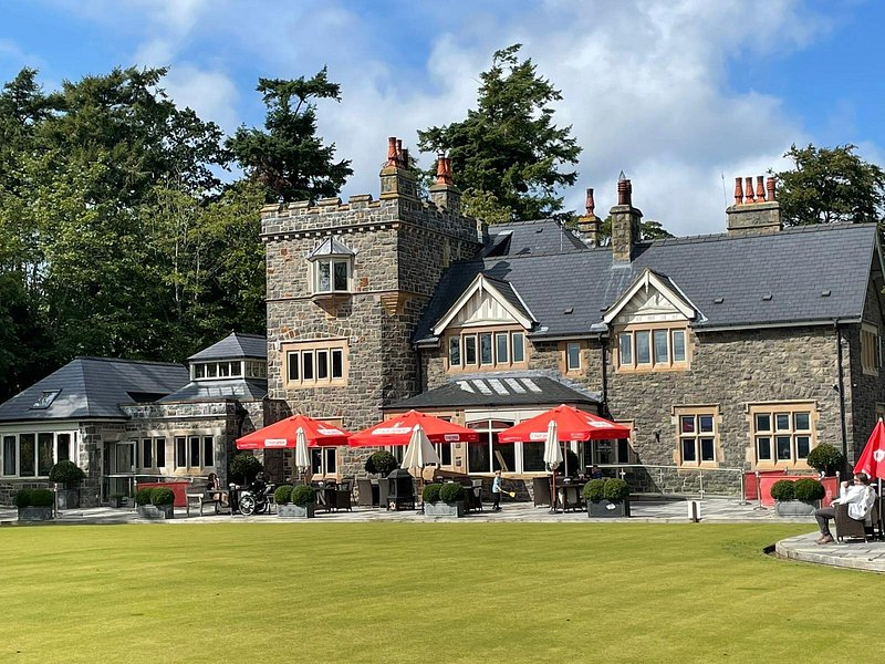 Restaurant exterior with red parasols, supplied for The Peppermill